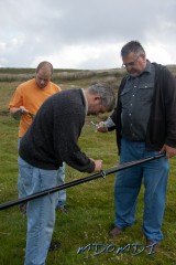 Bernd Bross (DH1SBB) getting started on the vertical antenna with the help from Adriano and Guenther Haug (DG1SBU)