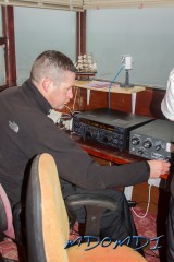 Ross Bane (GM1KNP) checking the bands at the shack at Scarlett Point, Isle of Man.