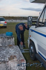 Mike Jones (GD4WBY) placing a vertical mast stand under the mobile shack.