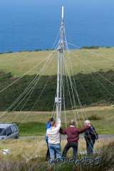The base of the antenna standing upright and starting to look like an English may pole
