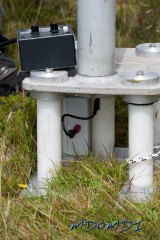 The feed point of the big vertical antenna showing the 4 large isolators as well that hold the antenna above the ground.