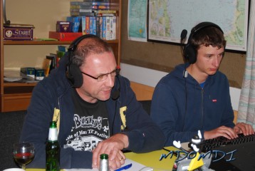 Mike (MD0VMD) working the radio with Andrea (DO2TGO) managing the logbook