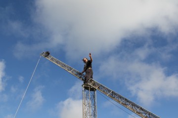 Standing on the top of the pivit mast for the VersaTower 120ft Mast