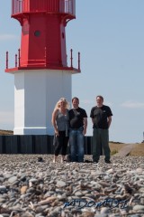 Sonja, Rainer (DG5SBK) and Claus (DO9BC) standing by 'The Winkie' at the Point of Ayre in the Isle of Man