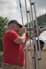 Steve kelly (GD7DUZ) making sure that things are correct at the top of the mast before it goes up.