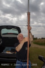 John Butler (GD0NFN) connecting the feeder to the antenna