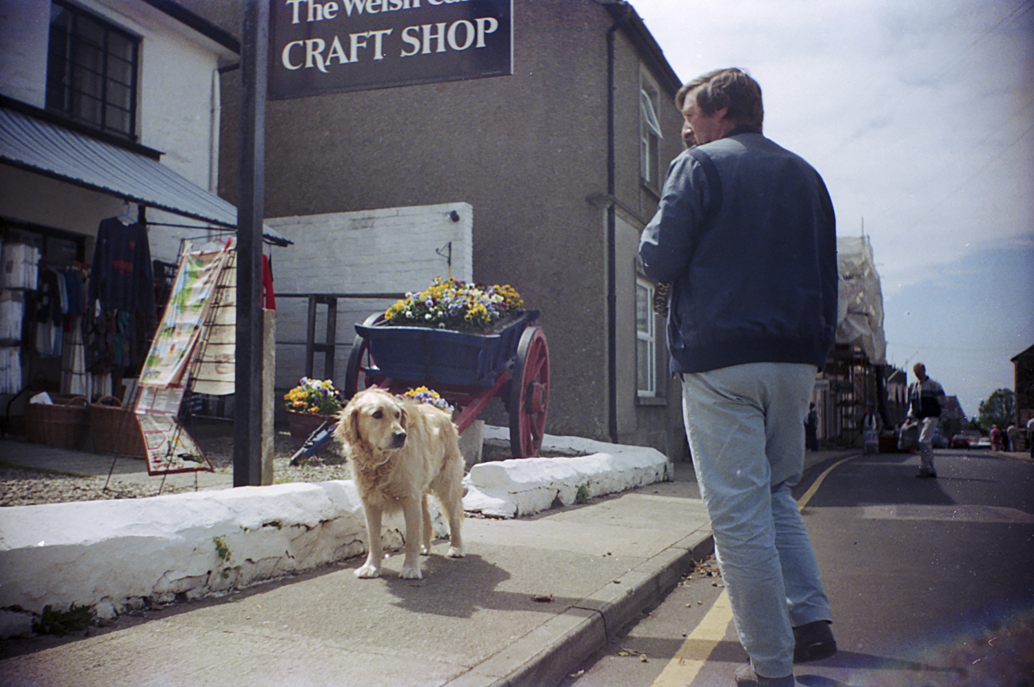 Winston Cooper walking Benson outside of his shop in St. David's