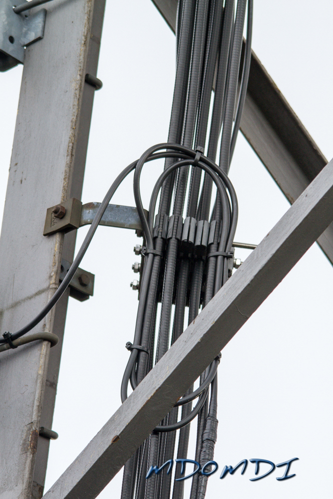 Feeder Coiled up on top of other feeders feeding antennas further up the mast.