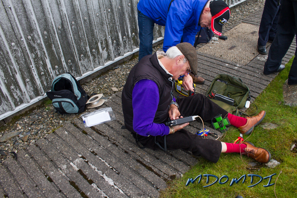 John Butler (GD0NFN) and Morgan Griffiths (MD0DXW) Camped out near the CAA Mast and out of the wind, we quickly setup the radio and a bodge of an antenna with a long wire and we quickly started making a few contacts.