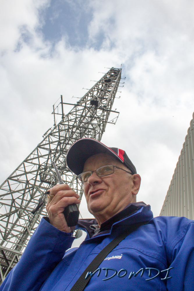 John Butler (GD0NFN) standing by one of the masts on top of Snaefell
