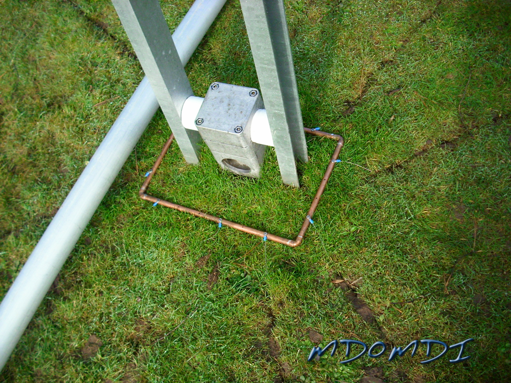 The the radials, we made a simple copper tubing square and then after digging in the radials they were simply attached with stainless self tapping screws.