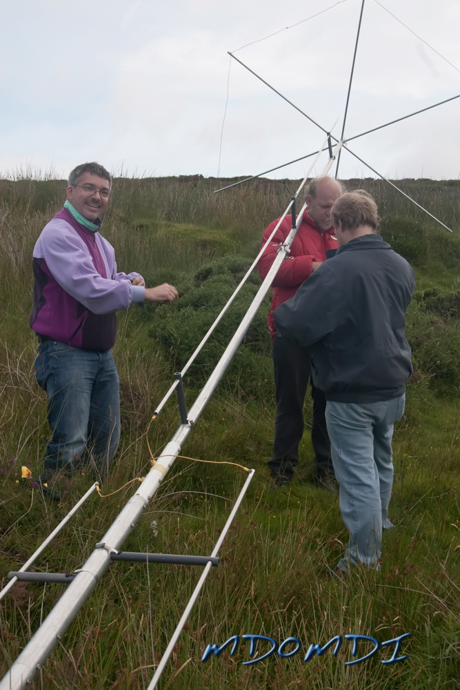 Bernd Bross (DH1SBB) looking very happy as they get near to raising the GAP Voyager vertical antenna, I think Peter Herring (DL1SPH) and Markus Wagner (DO5MZ) are just playing cards with each other.