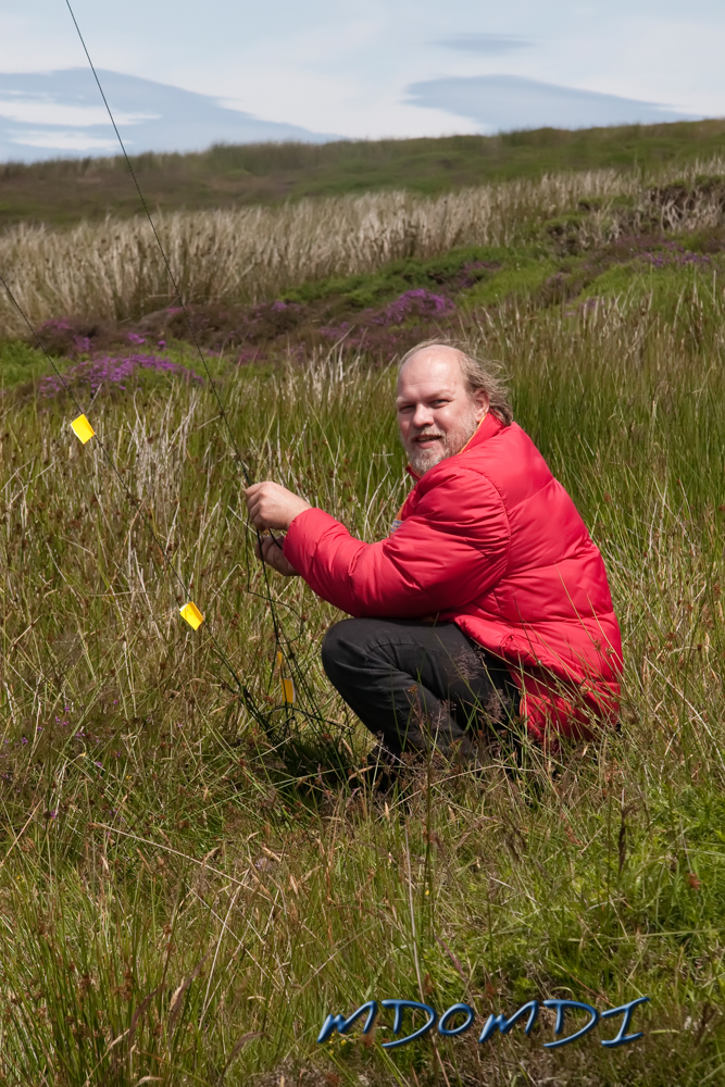 Peter Herring (DL1SPH) taking the relaxed approach to tightening up the guy lines