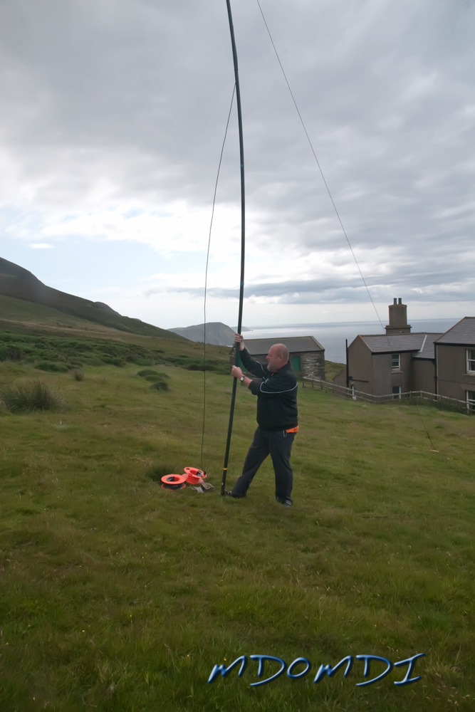 Erwin Kleiner (DL6SBN) putting up the poles that will hold the loop antenna in place.