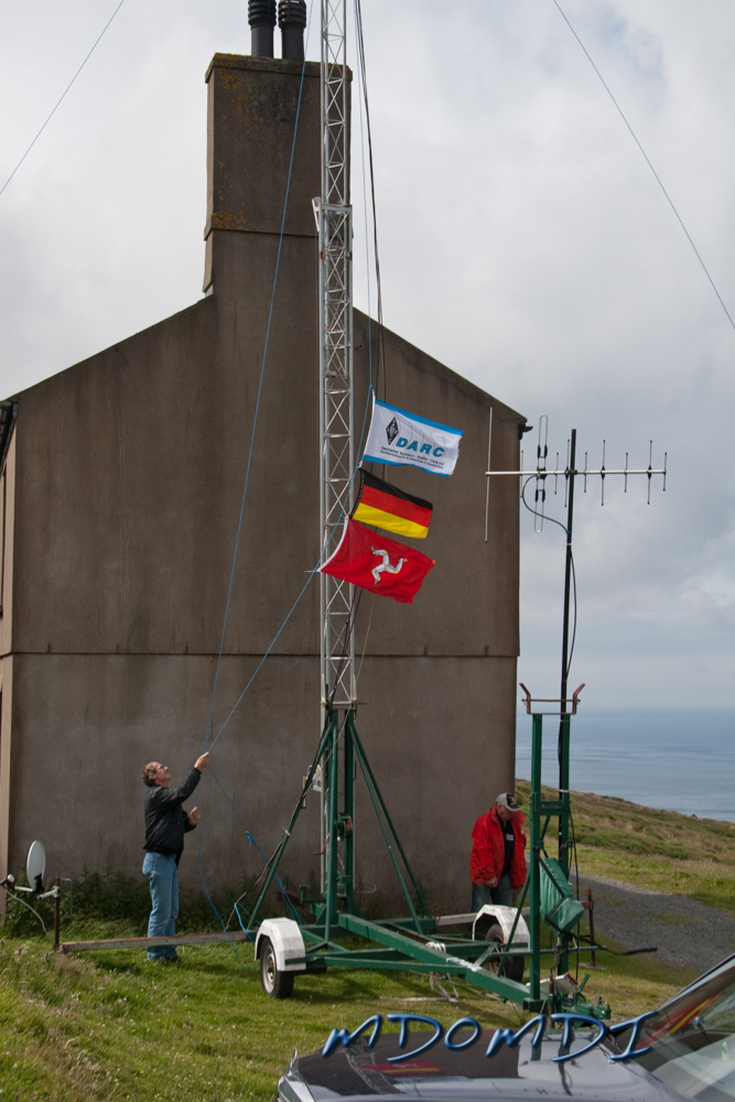 Eckehard (DO2ETM) adding the Manx Flag to the others and raising them over Eary Cushlin