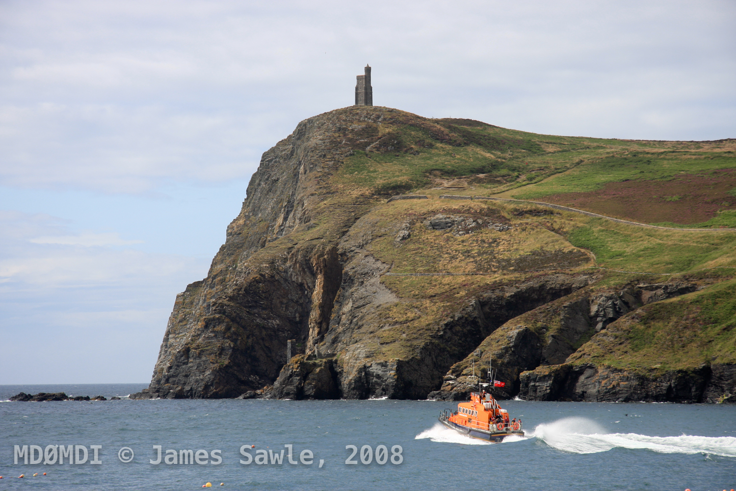 Making Waves - The Offshore RNLI Lifeboat making it's way out to sea below Bradda Head