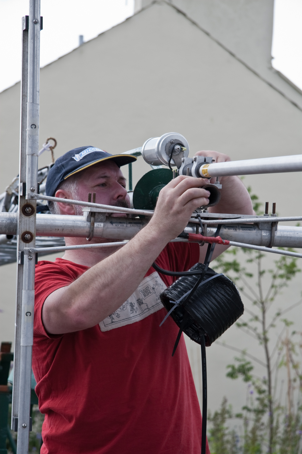 Steve Kelly (GD7DUZ) attaching the vertical to the top of the tower