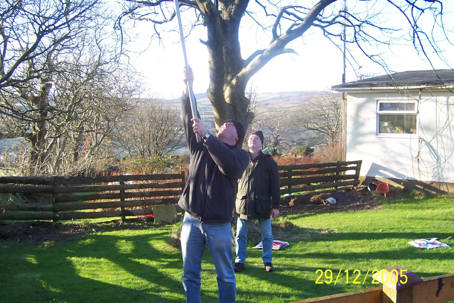 Putting Antenna Up through the Trees at the Old Club Station in Foxdale.