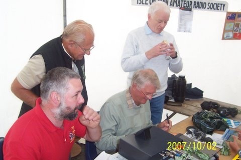 Unknown Event either Mad Sunday or Tynwald Day looking at the tent. - Steve Kelly (GD7DUZ), Dave Corkish (2D0RGW), 'Unknown' and John Butler (GD0NFN)