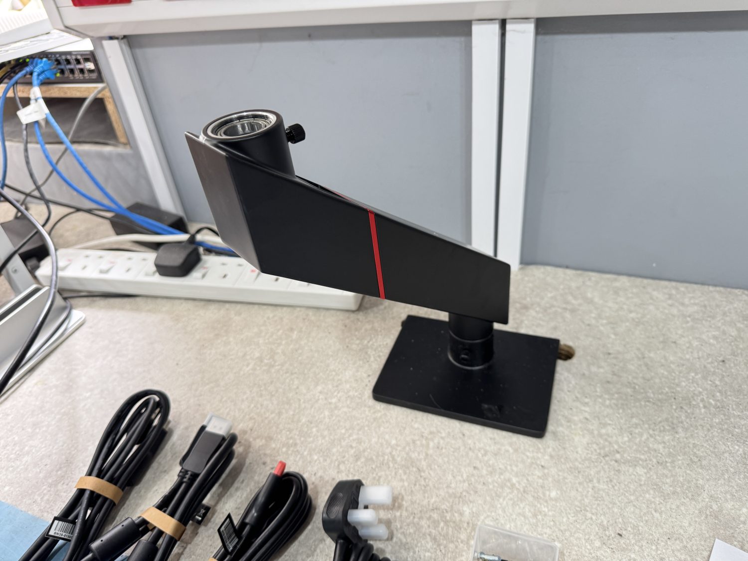 The base section of the Secretlab MAGNUS Monitor Arm assembled and waiting for the top section.